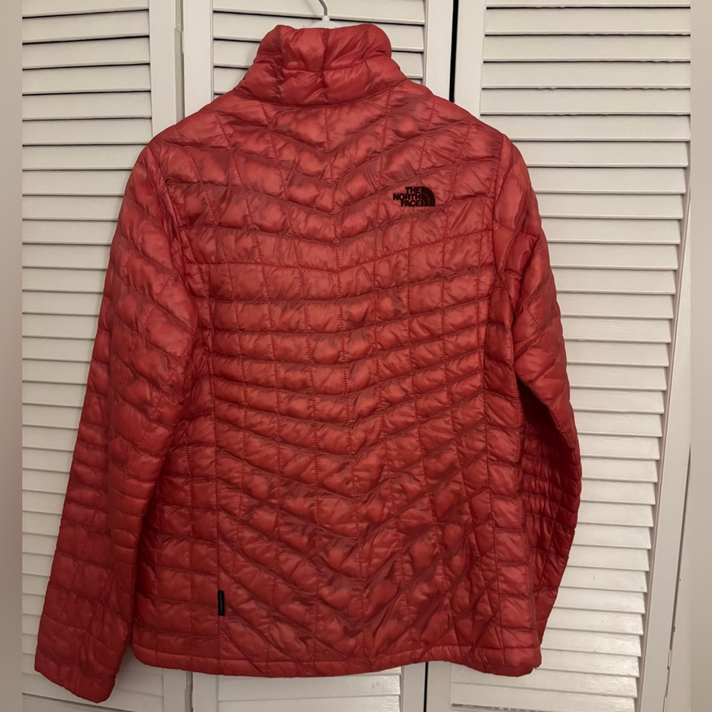The North Face Women's Quilted Puffer Jacket in orange